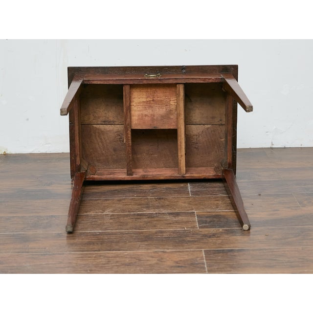 This English 19th-century oak side table carries a timeless elegance with its clean lines and understated design. The deep...