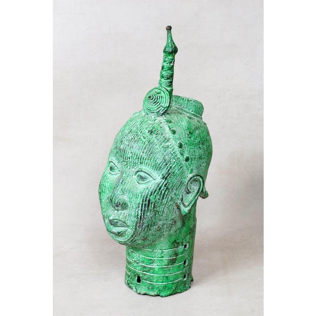 A beautiful benin bronze sculpture. Benin bronze objects, were used in west africa as a form of currency and thus status....