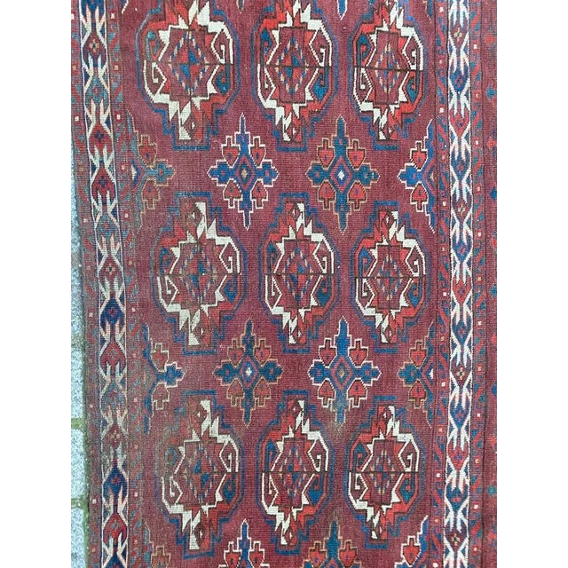 Nice 19th century horse cover Turkmen rug with a beautiful Bokhara design and natural colors with red, purple, orange and...