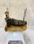 Metal sculpture depicting docked boat among cattails mounted on quartz. igned by artist. ee pictures for signature.