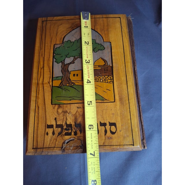 This is an authentic, highly collectible early 20th-century Jewish prayer book (Siddur) featuring a hand-finished olive...