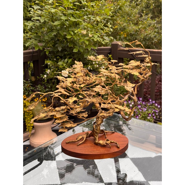 Val's Dollhouse is proud to present this one-of-a-kind piece of hand-crafted metal (likely brass) folk art. Mounted to a...