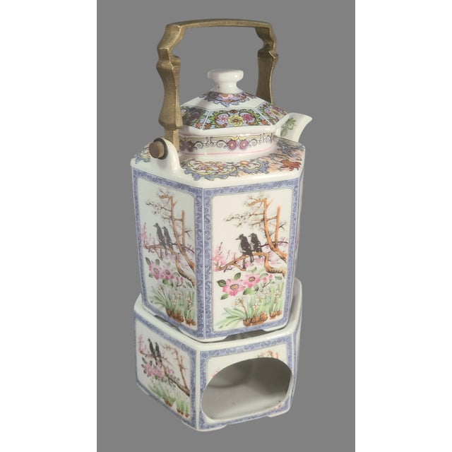 Elevate your tea experience with this Vintage Japanese Hand Painted Floral, Birds Teapot, featuring a beautiful brass...