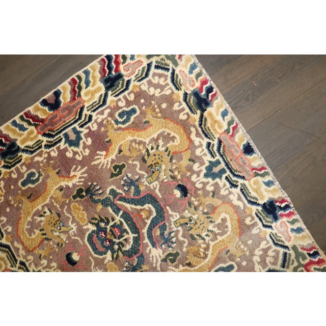 a mid 20th Century Dragon design square size tibetan rug
