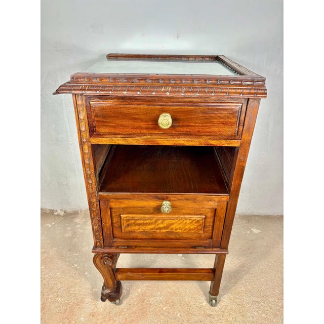 Exceptional Renaissance oak tea trolley cabinet featuring richly carved decoration, a glass inset top, side storage...