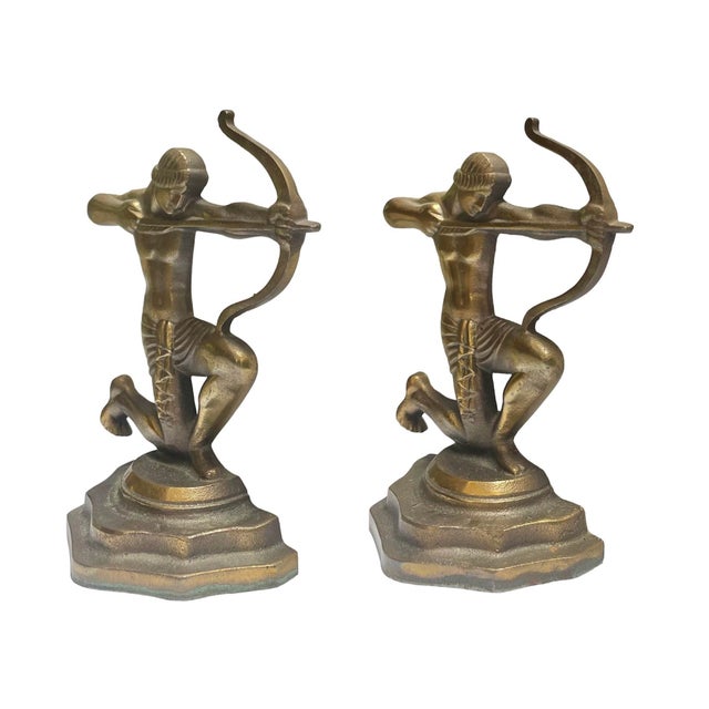 Late 1920s Art Deco bronzed bookends featuring a kneeling Roman archer.