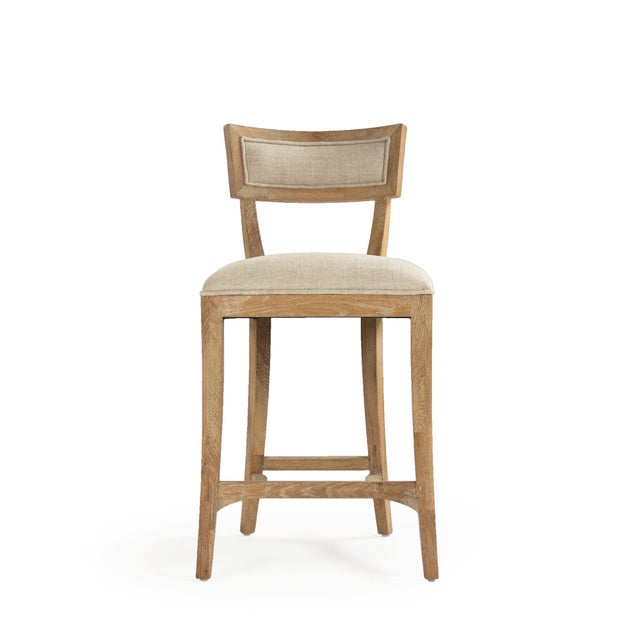 The Carvell Counter Stool from Zentique brings the collection's signature klismos-inspired silhouette to counter height....