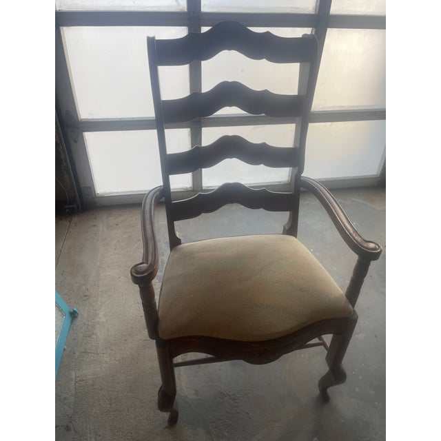 Pair of French Country Dining Room Arm Chairs with open slats and carved floral details.