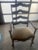 Pair of French Country Dining Room Arm Chairs with open slats and carved floral details.