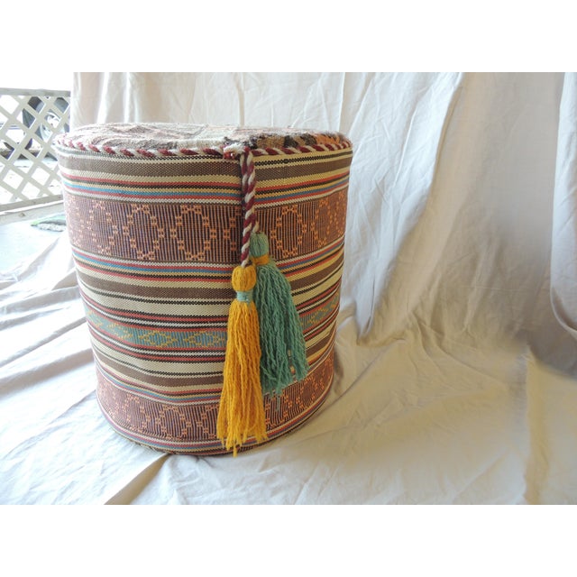 Orange & Brown Kilim Round Pouf Kilim Top Ottoman with Tassels Rope trim all around. Hanging hand-knotted tassels. Cotton...