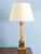 A striking French midcentury brass column lamp, featuring a square base adorned with stylised leaves, a fluted shaft with...