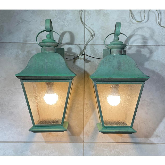 pair of vintage solid brass lanterns exudes timeless elegance and old-world charm. Crafted from , high-quality solid...