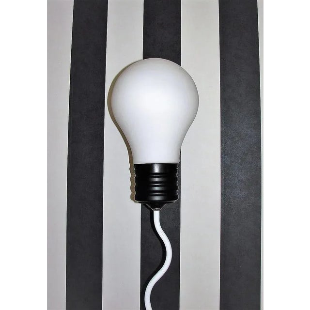 Floor lamp "żarówka" , 1980s . It was made of metal, the lampshade of glass. The lamp is preserved in good condition and...