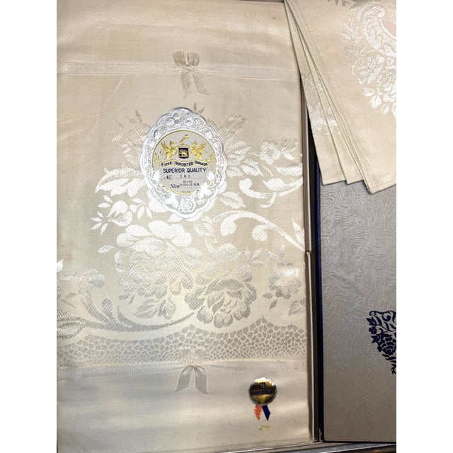 Elegant mid‑century damask table linen set by ALICO, known for producing high‑quality imported textiles during the 1950s....