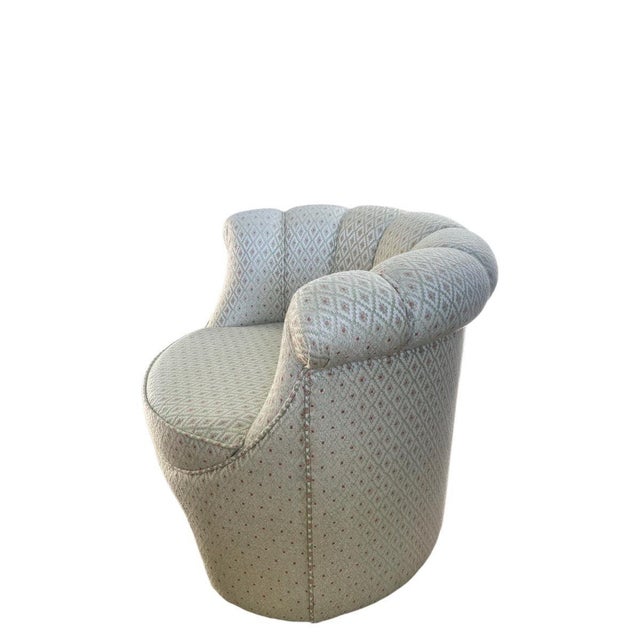 A custom upholstered armchair by Parisian designer Jean Rémy Couradette, produced in 2001 in France and defined by a...