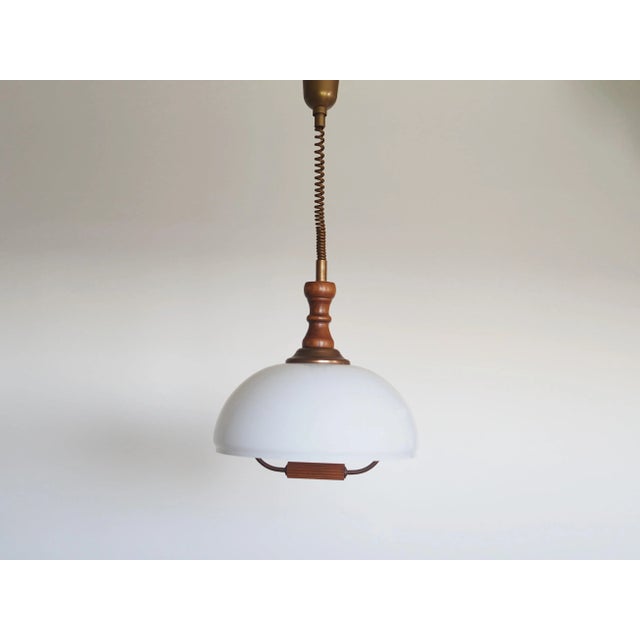 The lamp was made in the 1980s, Scandinavian design. Made of glass, wood and plastic. The unique construction is not only...