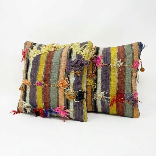 This beautiful 24'' x 24'' pillow cover set was made from authentic Turkish rug pieces. Bright colors of wool adorn the...