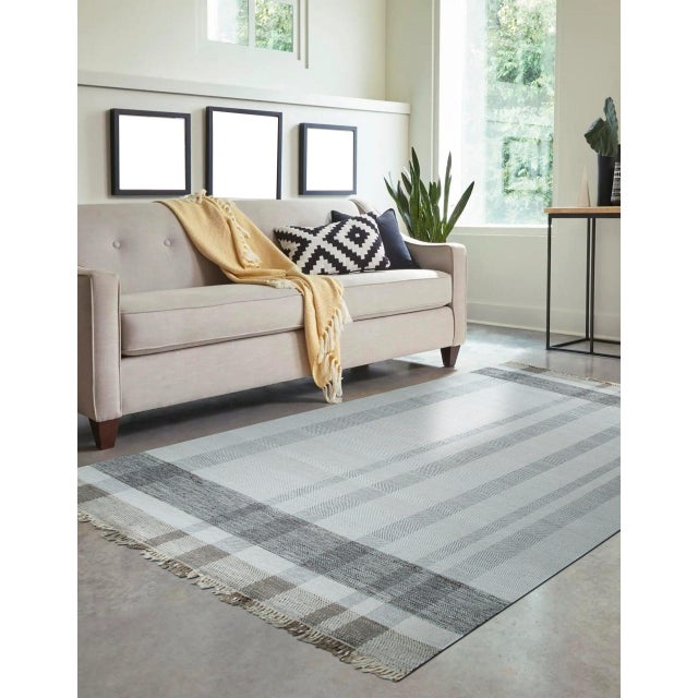 Giselle Serene Multicolor Flatweave Wool Rug, Country of Origin: India. This contemporary flatweave offers a striking yet...