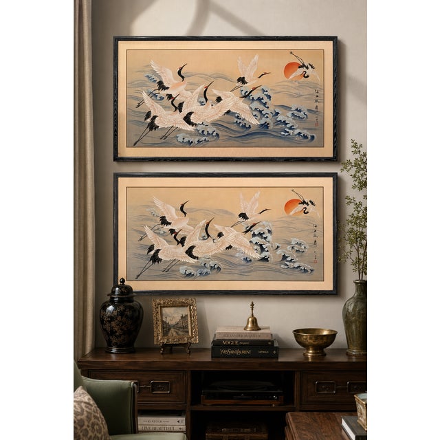 Beautiful pair of large vintage Japanese silk paintings depicting red-crowned cranes in flight above stylized ocean waves...