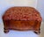 Dating to the late 19th -early 20th century, this charming serpentine-form footstool features a beautifully shaped wooden...