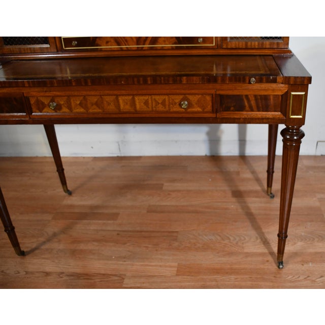Description: An elegant 1930s Wieman mahogany writing desk in the refined Hepplewhite Revival style, showcasing...