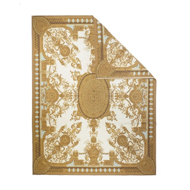 In an imaginative 19th century style, with a patterned elliptical central medallion, on an ecru field, with converging...