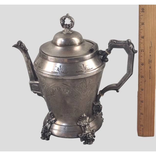 We are pleased to be offering this magnificent antique Victorian tea pot in triple plated silver hand engraved with...