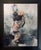 The artwork depicts a figure in a moment of introspection, hunched over as if caught in a personal reverie. The soft,...