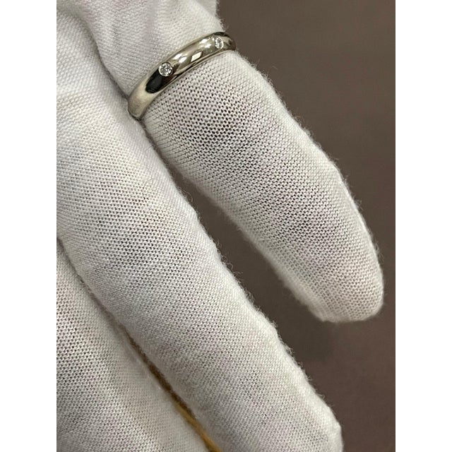 6 Flush Set Bezel Diamond Eternity Wedding Band in 18 Karat WhiteGold Size 5.5 Very clean and shiny diamonds. This...