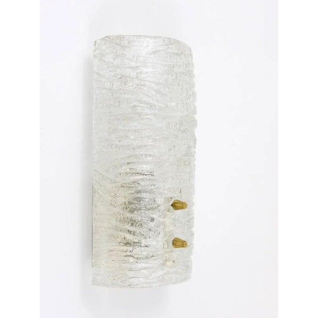 A beautiful pair of brass and glass modernist wall lights, executed by Kalmar Vienna in the 1950s. Very charming sconces,...