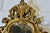 Attractive Rococo Style Small Gilt Wall Mirror The Mirror has an unusual shape, it has an elaborate wide gilt plaster...