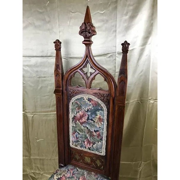 Commanding, dramatic, and beautifully steeped in old-world mystery, this late 19th-century Gothic Revival high-back chair...