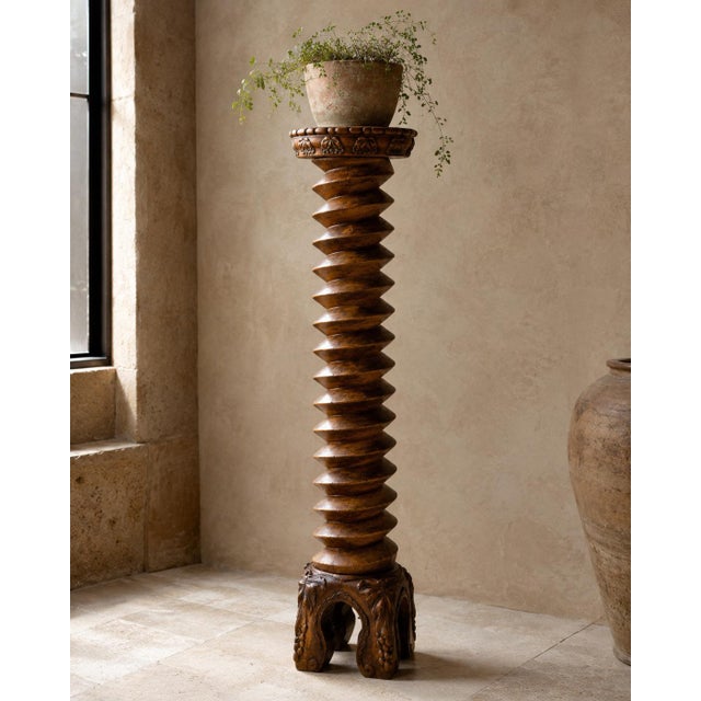A striking late 19th-century French wooden pedestal or plant stand, distinguished by its monumental screw-shaped column...