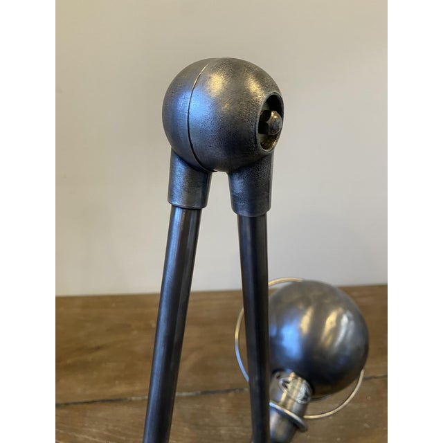 Authentic vintage Jieldé lamp with a clamp-style base, composed of two 40cm arms. Lamp completely stripped, brushed, and...