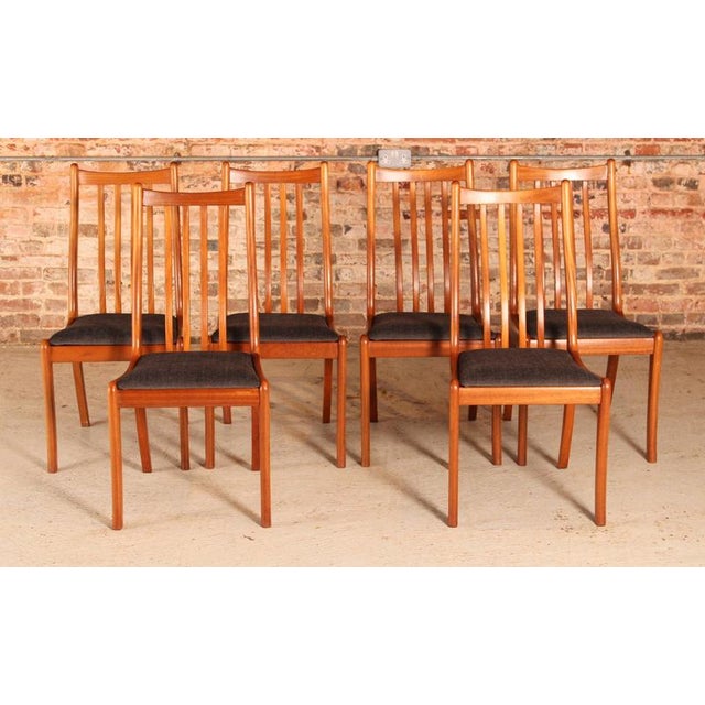 Set of 6 Mid Century teak dining chairs by White&Newton, circa 1960s. Newly reupholstered with slate grey fabric....