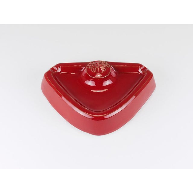 A stylish vintage dark burgundy alfa romeo ashtray from the 1970s. Crafted from glazed stoneware in a rich alfa romeo red...