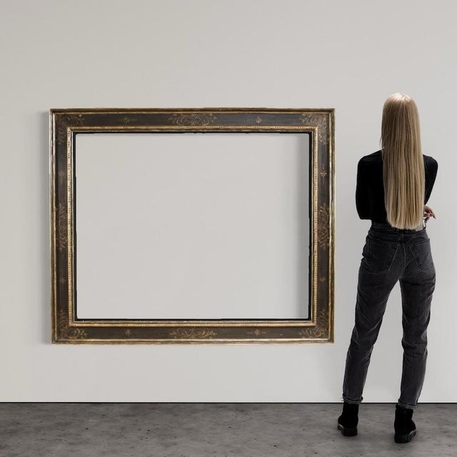 Great mid-20th-century Italian frame. A Tuscan-style piece of furniture in lacquered, gilded, and painted wood, of...