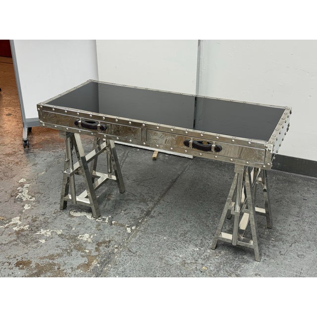 Design Plus Gallery presents the Flight Desk from Z Gallerie. This architectural desk combines polished stainless-steel...