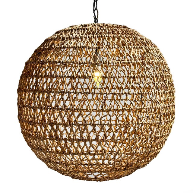 Large hand braided banana leaf globe pendant light. Natural beautiful varying tones of tans and browns. Includes 3' black...