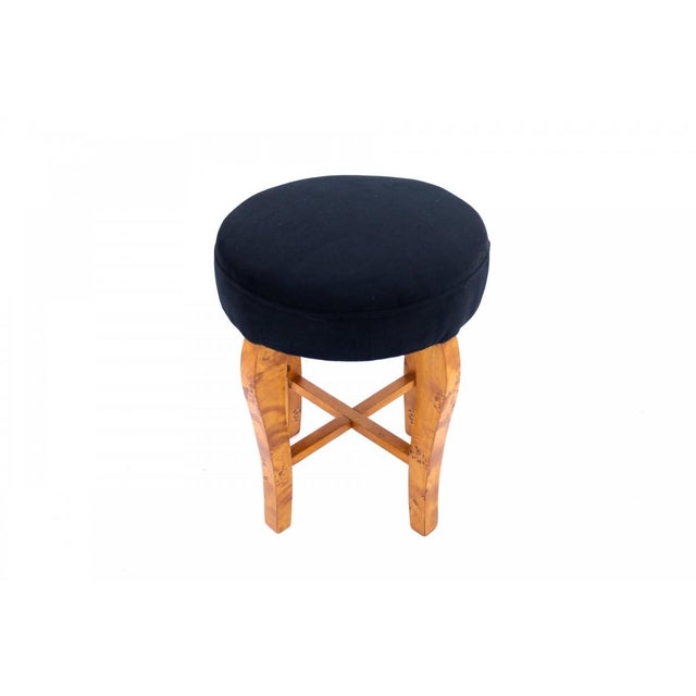 An elegant Polish Art Deco stool from the 1940s. It features a round, cushioned seat and a lightweight, sculpted frame...