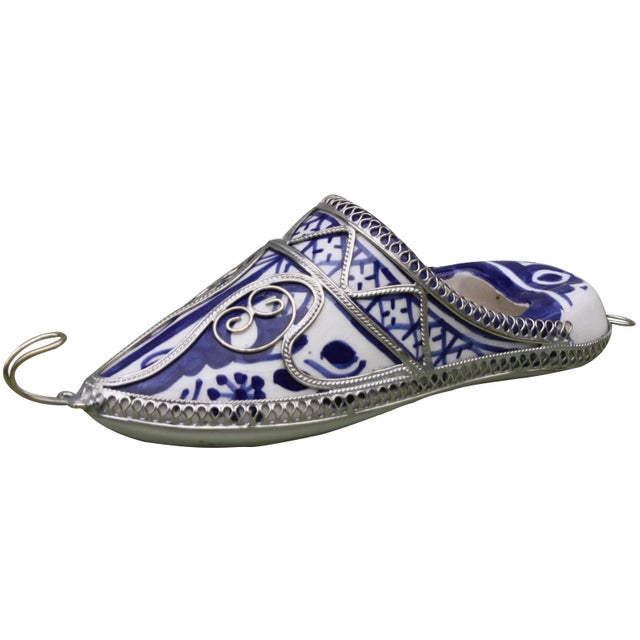 Handcrafted Moroccan ceramic babouche with hand-painted Moorish pattern and intricate silver inlay. This beautiful accent...