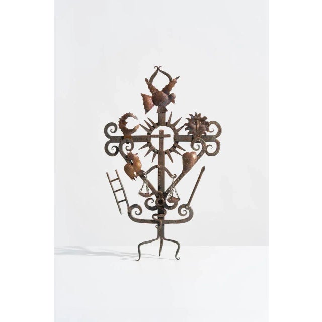 A masterful hand-wrought iron cross by renowned Chiapas metalsmith Guadalupe Hermosillo Escobar, showcasing extraordinary...