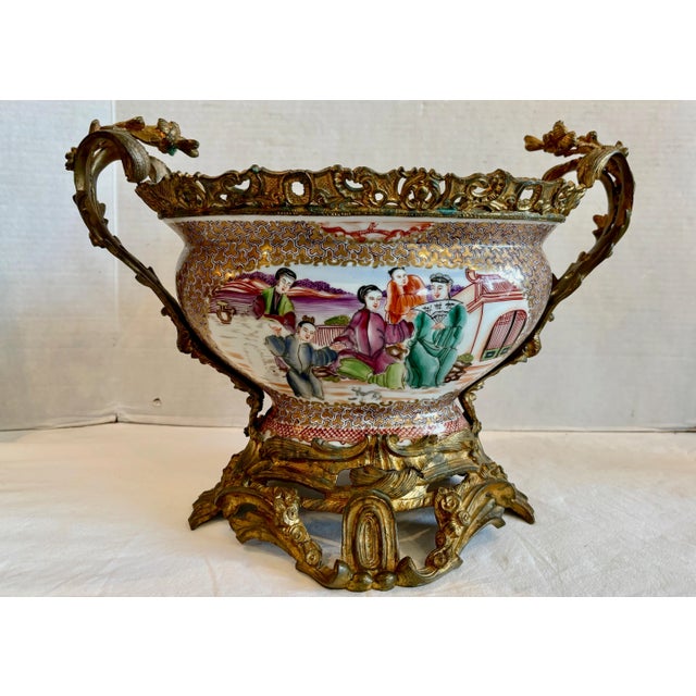 Richly embellished with fabulous French bronze base, handles, and gallery. The center bowl is exquisitely detailed and...