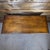 This is a Regency style inspired vintage side table in oak. It features carved accents on the front and scrolled feet....