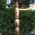 Hollywood Regency heavy brass swing-arm adjustable height floor lamp, with solid brass tripartite foot, atop mahogany...