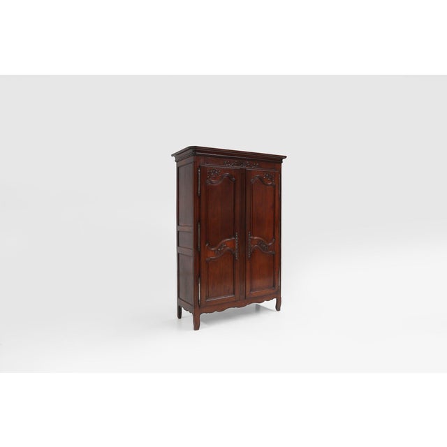 A beautifully hand‑carved French bridal armoire dating to around 1850, created in the refined Louis XVI tradition....
