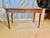 Found in France, this early 20th Century Writing Desk was crafted from Walnut by French artisans in the early 1900's in...