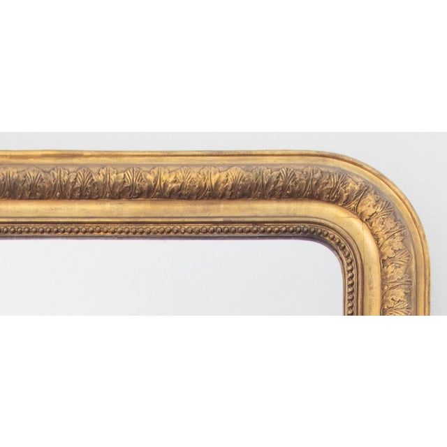 A gorgeous antique 19th-Century French Louis Philippe gilt wood and gesso mirror. From a superb old estate in Paris. This...