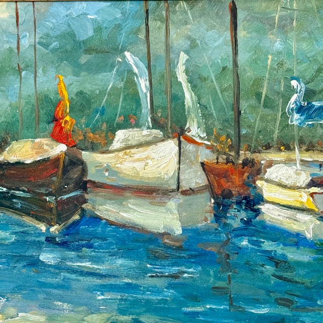 A bright and colorful oil painting showing sailboats on the bay, with loose, expressive brushwork and a relaxed coastal...