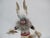 Hopi Native American White Wolf dancing Kachina doll. Hand painted wood with leather, yarn, fur, and feather accents....